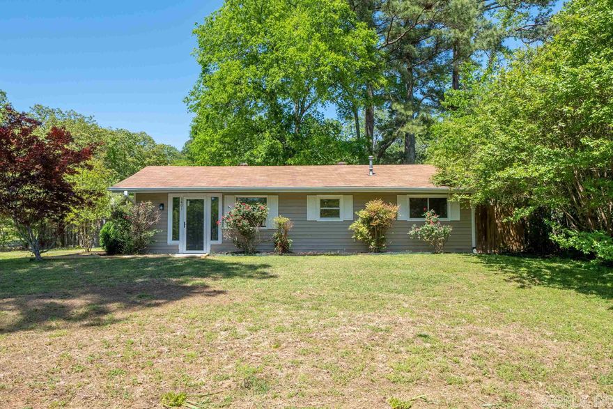 Don't wait!  Completely remodeled home! Great for first time home buyers!  Move in ready! Marble counter tops in kitchen and bath.  Freshly painted cabinets, interior walls and exterior of house. Brand new HVAC system, new flooring throughout, new porcelain tile in shower, new backsplash in kitchen, new stove and island with storage. Fenced in backyard with a storage building with deck. Beautiful rose bushes and a Japanese Maple tree in the front yard on a corner lot in Lakeside School District! Call listing agent/owner to see it today!