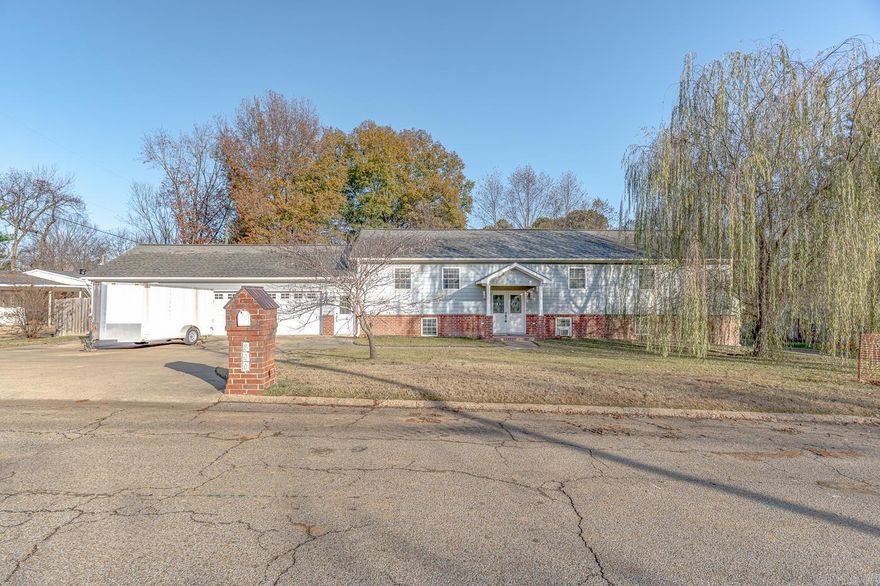 Welcome to 800 Parkview in Jonesboro! This spacious split-level ranch offers 3,100+/- sf of living space, a 3-car garage, and a level corner lot. The exterior features architectural shingles, full gutters, brick and Masonite siding, and a privacy-fenced backyard with a large deck perfect for relaxing or entertaining. Inside, the main level includes 1,550 sf with two living areas, a generous kitchen with Corian countertops, beautiful cabinetry, stainless steel appliances, and durable bamboo & tile flooring. The primary suite features a walk-in shower, jetted tub, double vanity, and a spacious walk-in closet. A second bedroom, full bath, and a laundry room with hookups, utility sink, and deck access complete this floor. The lower level adds another 1,550 sf with two finished bedrooms & a finished bathroom w/ a walk-in shower and the rest of basement is drywalled and ready for flooring and paint. The 600 sf unfinished space is easily finishable and includes a shower ready to install. Additional features include electric HVAC and water heaters, spray-foam insulation, a floored attic, and a garage-to-home firewall for peace of mind. Call today to schedule your showing!