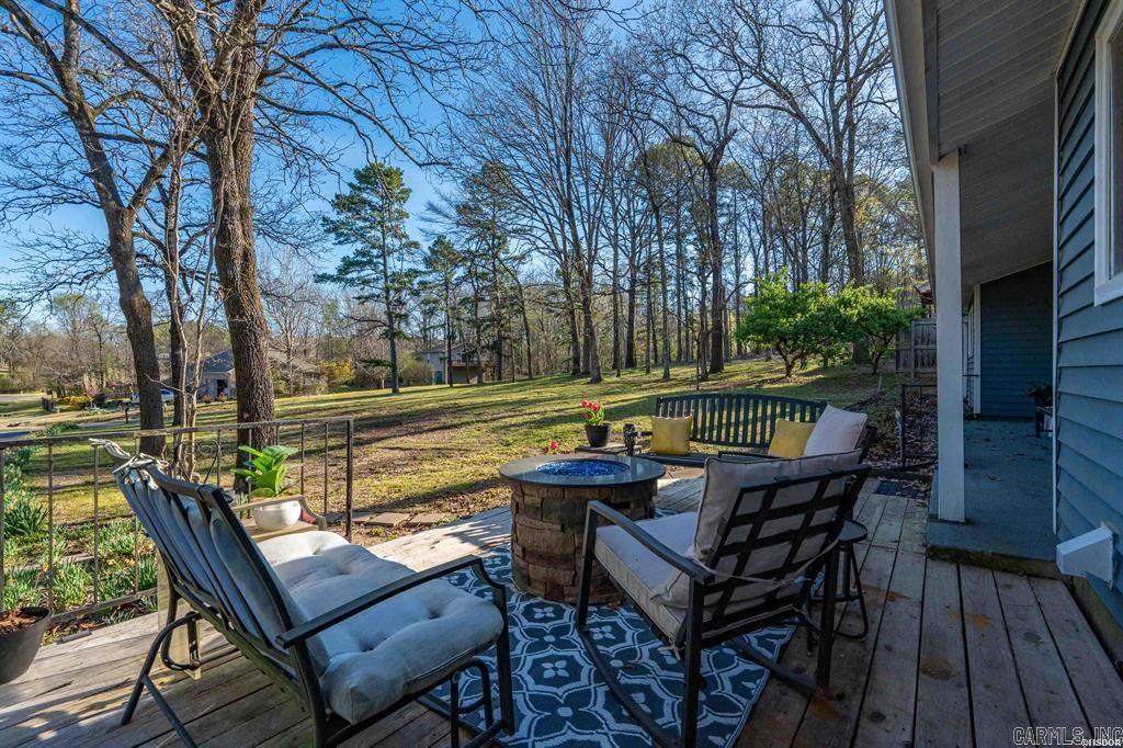 This adorable home is ready for a new owner! There are so many features, it is hard to mention them all. Enjoy the front porch sitting area, just across the street from the golf course. 3 bedrooms, 2 full bathrooms, private office, and spacious laundry room. The sunroom features a hot tub and office to overlook the back yard, surrounded by nature for extra privacy. The primary suite has a heated jetted tub, double vanity, and walk-in shower. Don't forget the mancave just off the front porch. All mounted TVs convey. On top of everything in this home, you have the amenities of Diamondhead just minutes from downtown Hot Springs & Oaklawn racetrack. Diamondhead offers a PGA sanctioned golf course, Olympic size swimming pool, children's playground, tennis, basketball & pickleball courts, clubhouse, community library, exercise room & lots of friendly neighbors.
