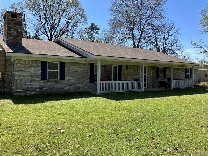 Open House Rescheduled to Saturday June 6th 2- 4pm.  Peaceful Country Living, imagine winding thru the trees coming home to your new house! Convenient both to town and De Queen Lake (3 miles in either direction).  Lovely brick home on a slab foundation is ready to move-in. Extra Large Kitchen overlooking a lovely dining room and a Large Living room with a brick Fireplace w/blower.  Luxury vinyl plank flooring, tile in the bathrooms and brand new carpet in the bedrooms.  Interior boasts fresh paint in a nice neutral theme just ready for your color pops! Both bathrooms have been remodeled in the last 4 years.  The second bath has an extra large tile shower. Closets are extra deep. Outside of the home there is a lovely covered front porch and a big covered back porch to take advantage of the views in both directions.  Nice large brick well house / storage building, 2-car carport and a shop/barn with concrete floors. Property also shares a stocked pond with the neighbor, and has lovely trees including two huge pear trees along with cleared spaces for gardening or livestock.  Roof new in 2022. A setting like this is hard to find anymore!