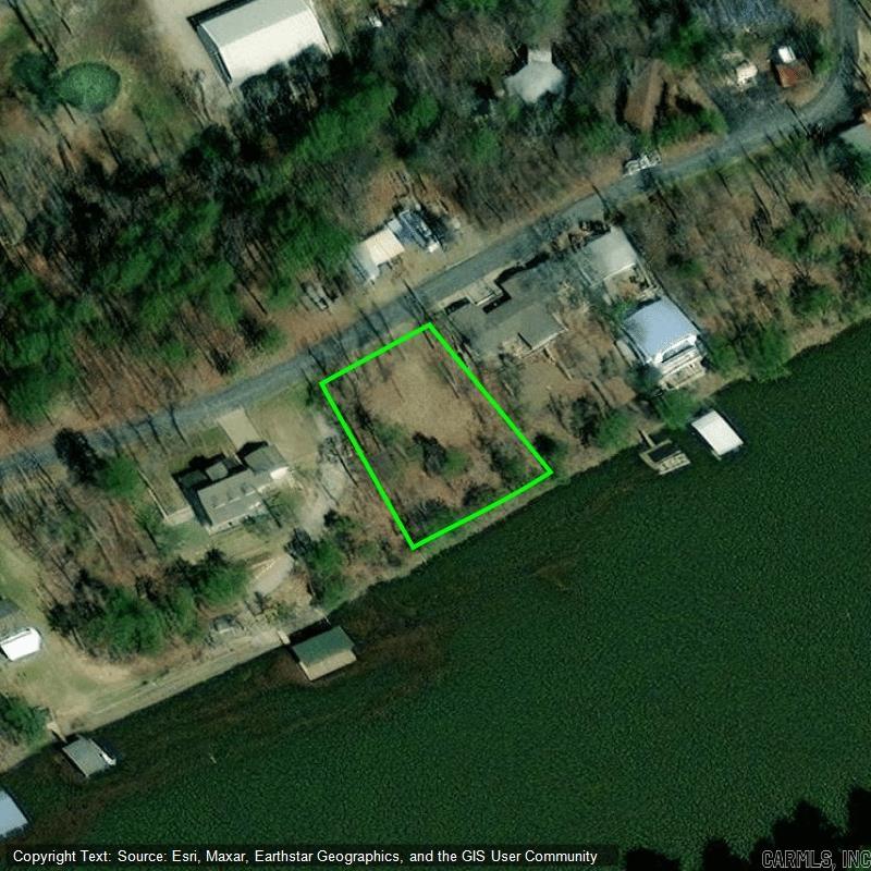Are you looking for a lake front property that's out of city limits and offers year round water with beautiful views? If so this is your lil piece of Heaven! Enjoy the beauty of Lake Hamilton year round! Deep water on the Little Mazarn! It's a Fishermans dream! Approximately 10 minutes to Bypass and convenient to everything by land and water! Call your favorite agent today to schedule a showing!