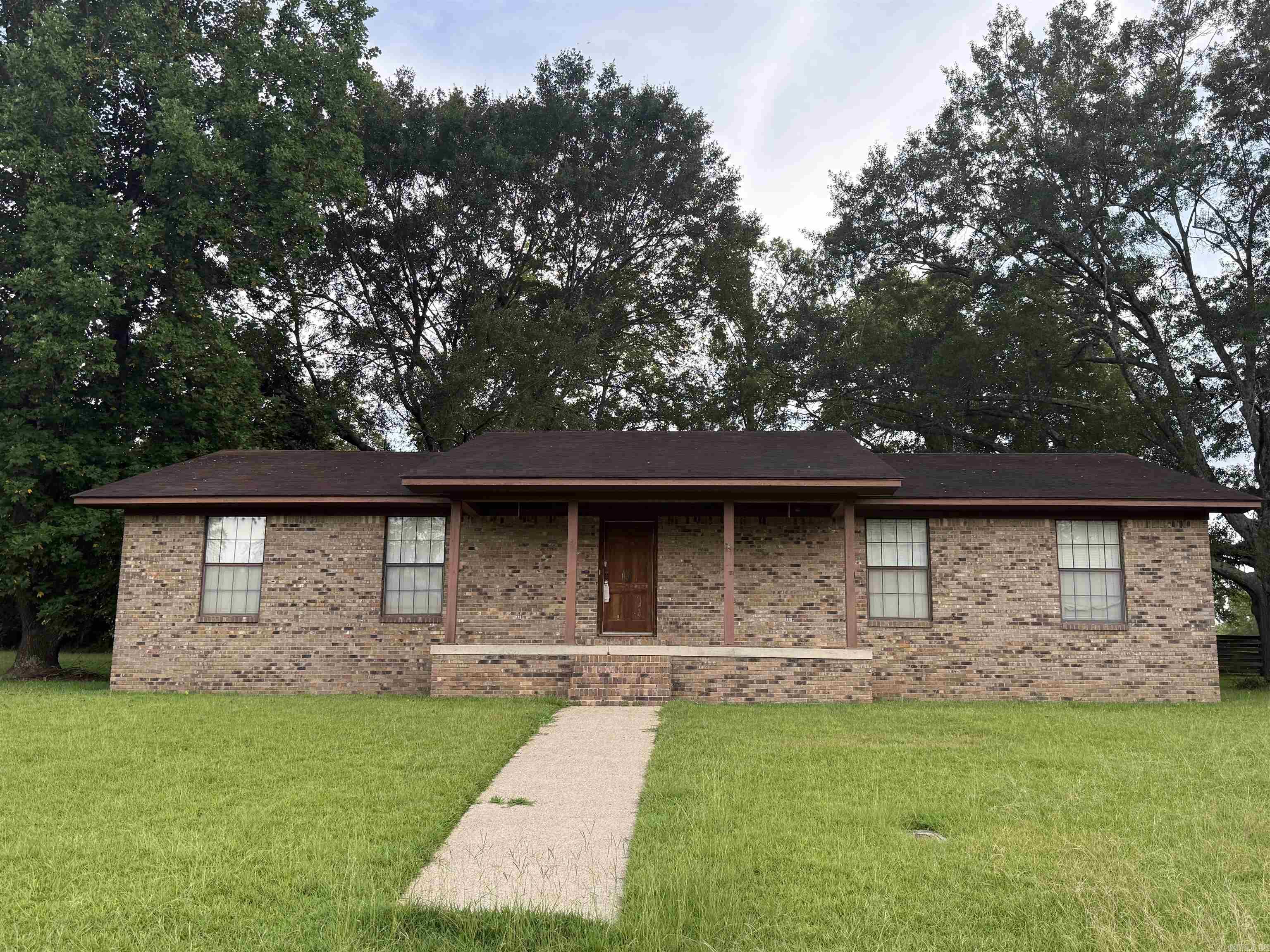 Brick home located in Greenwood Subdivision, close to city park and within walking distance to Nashville public schools. Home offers over 2,460 sq. ft. of living space, 3 bedrooms and 3 baths, large kitchen, den with fireplace and large formal living/dining room. CH/CA, city water and city sewer, double carport on a oversized corner lot. Home is being sold " AS IS" with no disclosures.