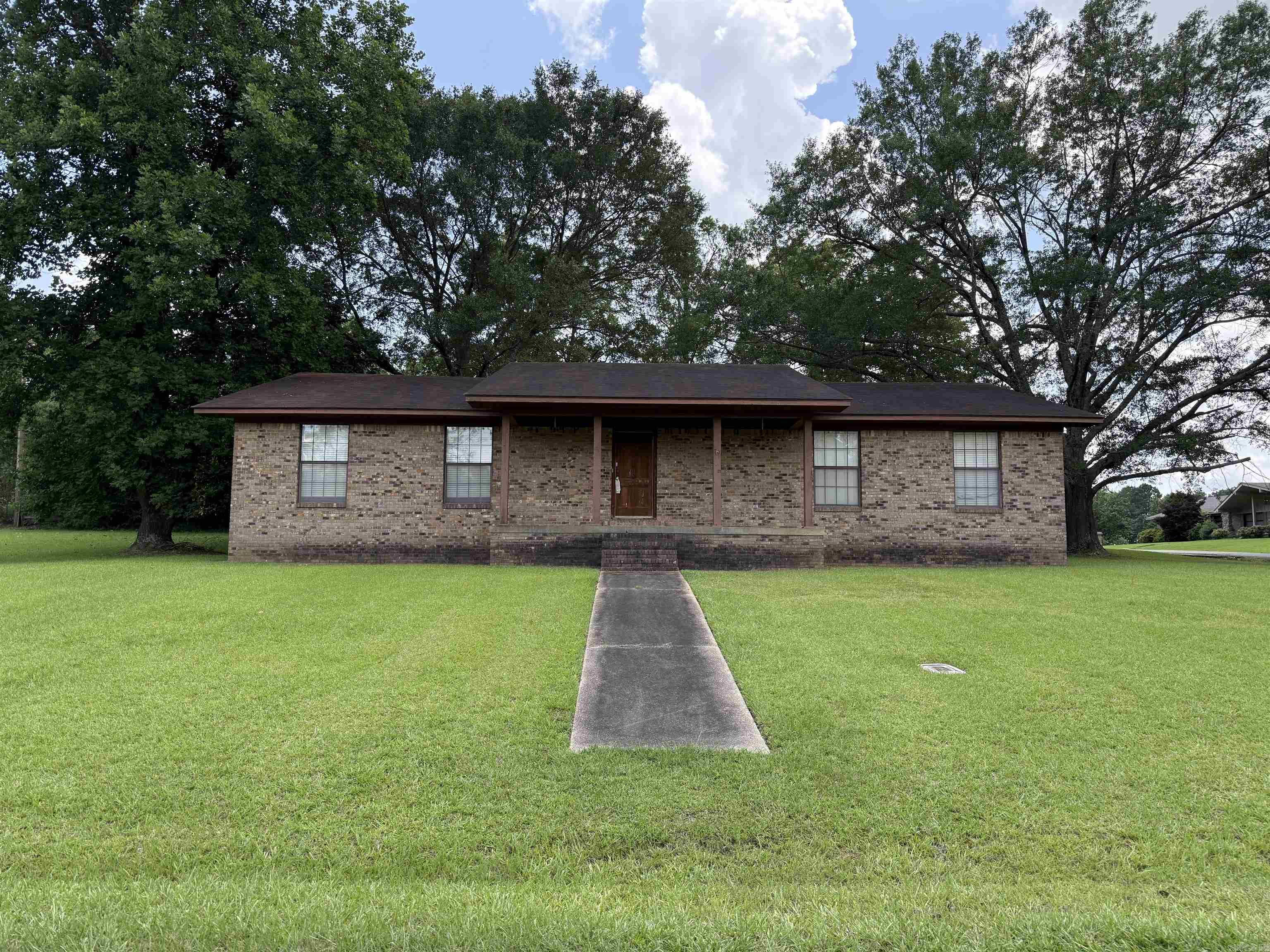 Brick home located in Greenwood Subdivision, close to city park and within walking distance to Nashville public schools. Home offers over 2,460 sq. ft. of living space, 3 bedrooms and 3 baths, large kitchen, den with fireplace and large formal living/dining room. CH/CA, city water and city sewer, double carport on a oversized corner lot. Home is being sold " AS IS" with no disclosures.