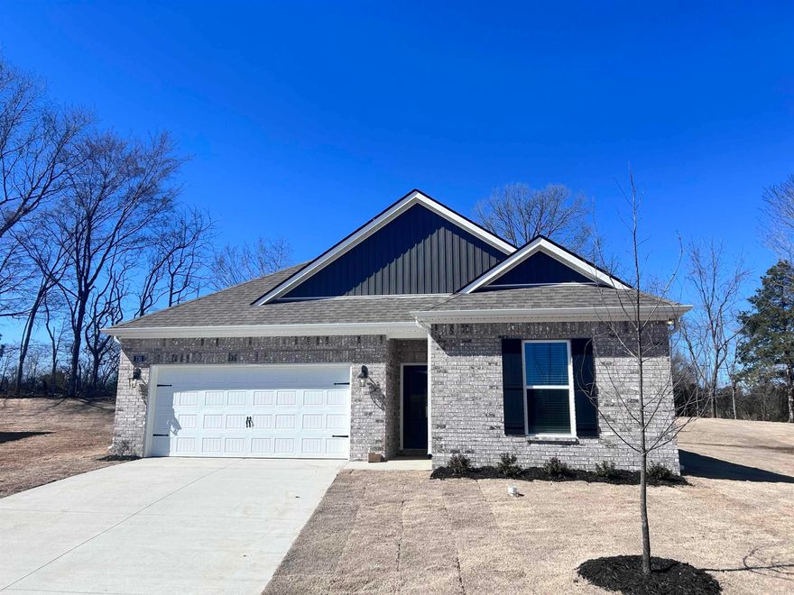 Move-In Ready!!! The appealing one-story home includes many contemporary features.  An open-concept design including 9' ceilings enhance the wonderful feel of this home. The kitchen includes a large counter perfect for bar-style eating or entertaining, a spacious pantry and plenty of cabinets and counter space. The large living room overlooks the patio, which is a great area for relaxing and dining al fresco. Bedroom One, located at the back of the home for privacy, can comfortably fit a nice size bed, and includes an en suite bathroom with a vanity and big walk-in closet. Two other bedrooms share a second bathroom. The two-car garage connects to a small hallway where the laundry room is located. Pictures, photographs, colors, features, and sizes are for illustration purposes only and will vary from the homes as built. Additional Features include: granite countertops, kitchen appliances provided are refrigerator, stove, microwave, dishwasher, electric fireplace, brick, gutters, blinds, double sinks in master, walk in shower, 2 car garage, 10 year warranty.