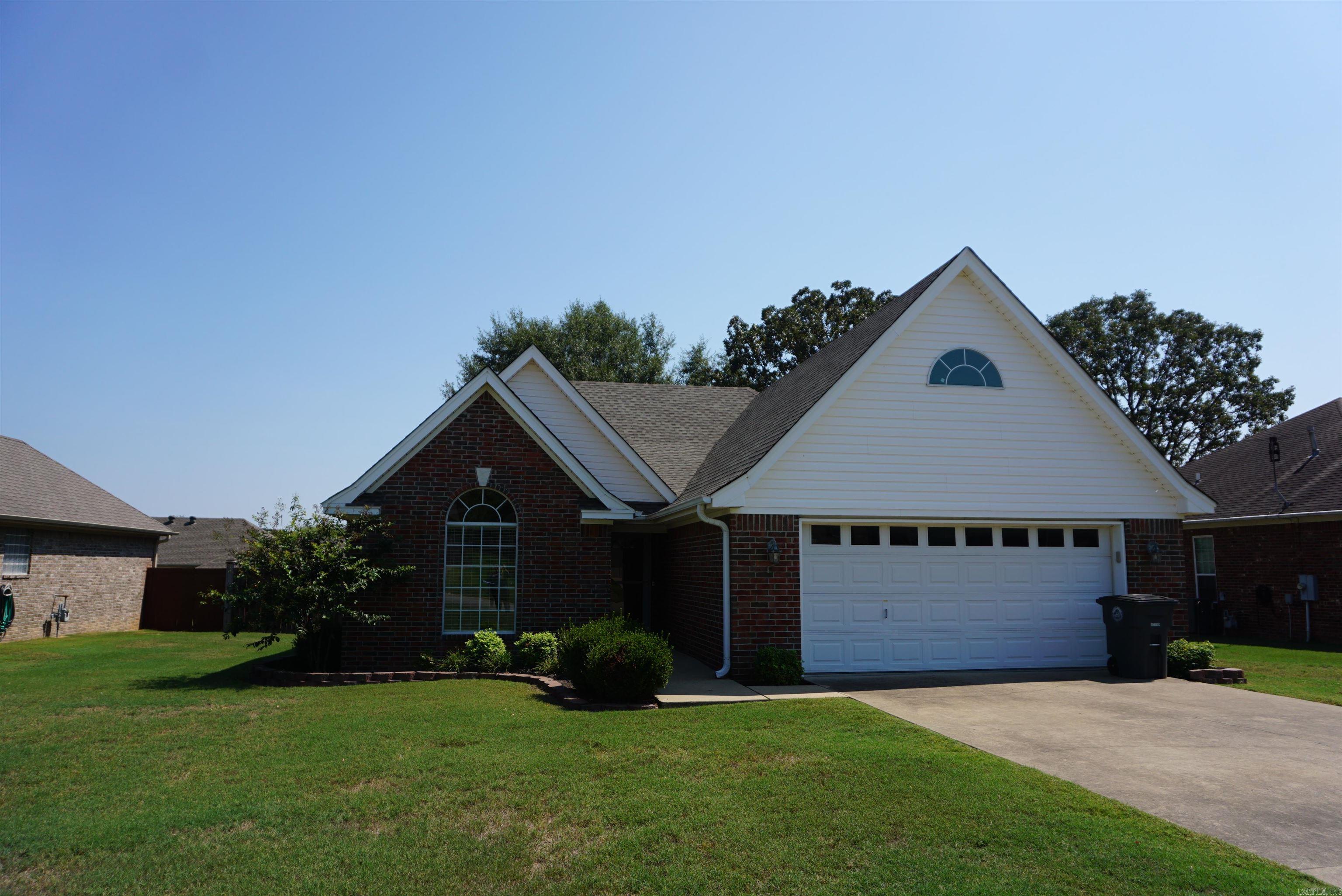 Beautiful 3/2 brick home in Searcy. This house has a very large open living space, perfect for entertaining with easy flow to the kitchen. There are 2 places for dining furniture or you could make 1 a sitting area off of the living room. Gas log fireplace in the living room, new LVP flooring in the living/dining/kitchen and light warm paint colors. Nice cabinets in the kitchen and the appliances, including the refrigerator will stay. The spare bedrooms are great size and have nice closets. The main bath has a tub/shower unit. The primary suite is a large size bedroom and a walk in shower with separate tub plus his and her closets with built ins and a double vanity. The laundry room has extra cabinets for more storage. The covered back porch is large and the back yard is privacy fenced. There are blinds on the windows and the HVAC and Water Heater were both replaced in 2022 and the roof was replaced in 2024 and microhood in 2025. The seller is offering a $5,000 flooring allowance with acceptable offer. Such a well cared for home in a Great Subdivision.