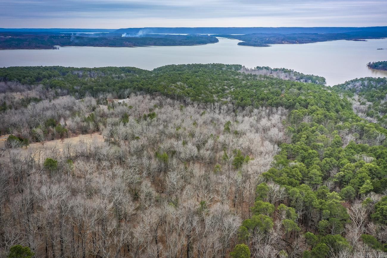Welcome to an acre of paradise in Edgemont, AR! This beautiful piece of land is nestled between Greers Ferry & Fairfield Bay. Nearby Devils Fork Park, offers lake access to Greers Ferry Lake. This prime location provides you with all the amenities of the two towns nearby including shopping, liquor shops, and golf. Enjoy beautiful views of the lake, two creeks, and pond on the property. Full of wildlife & serenity, this is the perfect spot for your dream home! With easy access to all the amenities of Greers Ferry and Fairfield Bay, you can have the best of both worlds- a peaceful, secluded retreat & all the activities you would want! Don't miss this opportunity to own a slice of paradise.