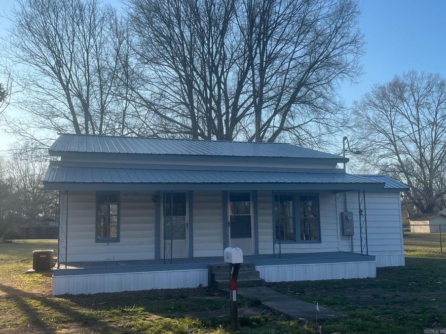 Totally remodeled. New metal roof, new CH/A, beautiful hickory floors, big windows & big open rooms. House can be purchased with front lot for $110,00 or both lots for $125,000.
