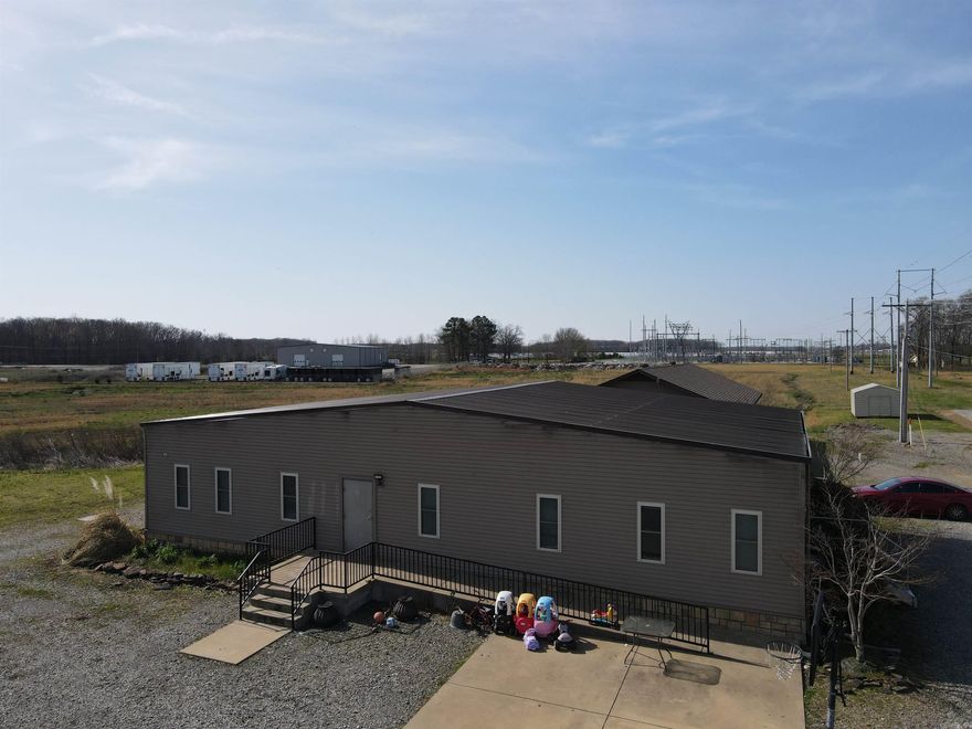 This spacious 2,501 sq. ft. multi-family manufactured home offers 9 bedrooms, 2 bathrooms with laundry facilities, a full kitchen, and a large living area. Additionally, there are two offices, which could be converted into extra bedrooms if needed. Conveniently located off Eastline Road with utilities already available on-site, the property is situated on one of the busiest highways in Searcy, Arkansas, in the heart of White County. The strategic location provides easy access to essential amenities such as Walmart and Lowe's. Searcy offers a unique blend of small-town charm and urban conveniences, with a variety of restaurants, boutiques, shopping centers, and department stores nearby. As a college town, home to Harding University, Searcy fosters a vibrant community atmosphere. The area is also served by excellent schools, including the Searcy Public School District, Riverview School District, and Harding Academy School District. This property is part of a larger parcel that includes additional land and buildings. For more information, please refer to MLS #24009026.