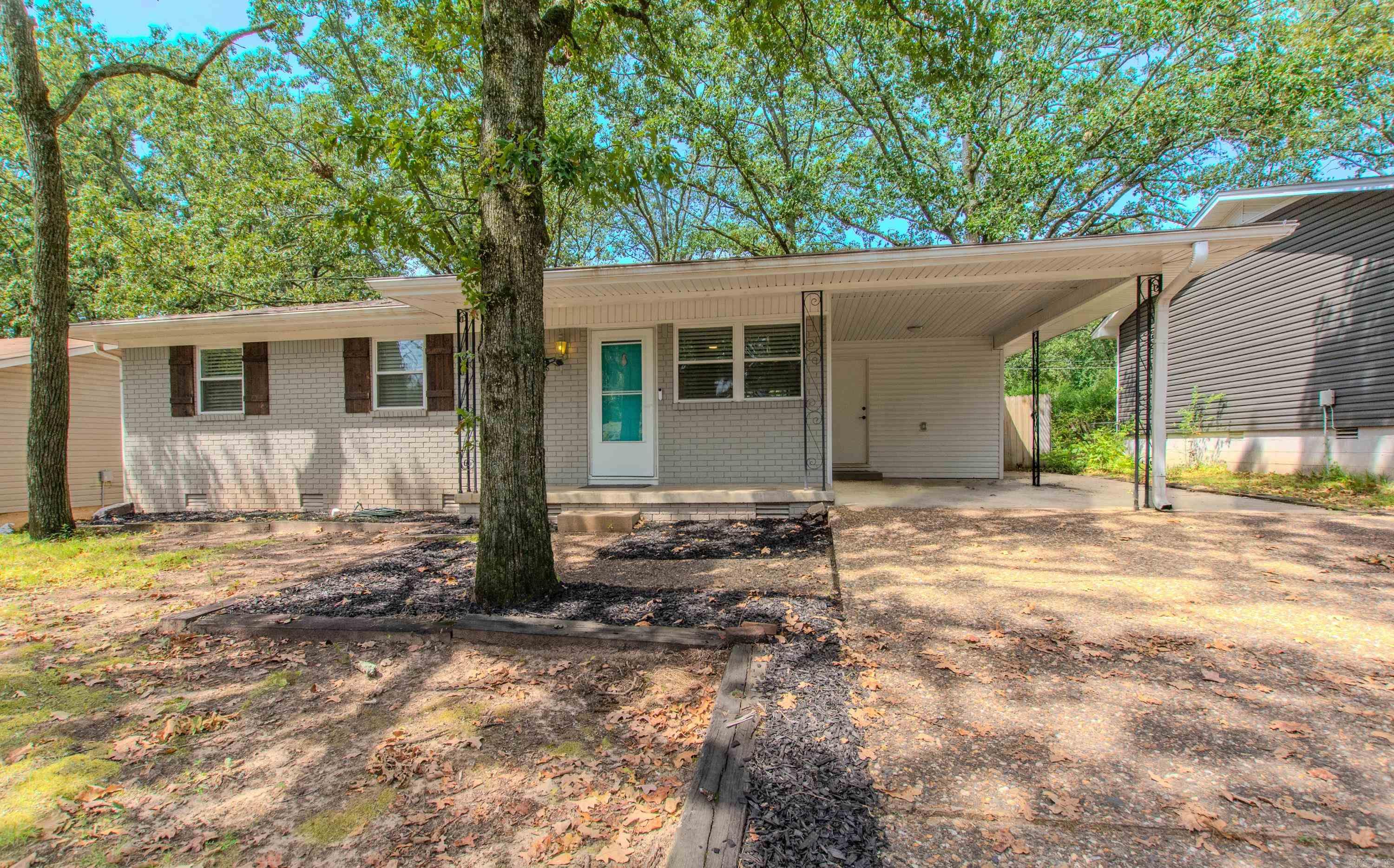 Updated and move in ready cutie located in the heart of Sherwood. Conveniently located to shopping, restaurants, grocery stores, freeway access, and the Bill Harmon Community Center. Nice open floorplan with extra crown molding accents throughout, updated vinyl windows. Kitchen features stainless steel appliances, kitchen refrigerator, gas cooktop with island range hood, quartz counters, lots of cabinetry, pantry storage, breakfast bar, mosaic backsplash, farm style sink, and island built-in microwave cubby. Large subway tiled shower, wood-like tiled floors, with double sink modern vanity, and towel rack. New architectural shingle roof installed February of 2024, Commercial grade water tank-2017. This home is equipped with ductless mini-split systems for great energy efficiency and low electric bills. One car carport with an extra parking pad extension. French doors lead to a big fully fenced backyard with a 27 x 8 shop with electricity and an additional 12 x 8 storage building. Please see Agent Remarks.