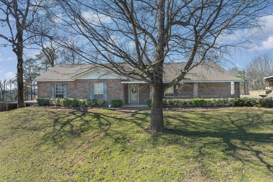 Welcome to this beautiful 3-bedroom, 2-bathroom home offering 2,266 sqft of comfortable living space, located on 5 acres just outside the city limits of De Queen, Arkansas. The open floor plan seamlessly combines the living room, kitchen, and dining areas, making it perfect for family gatherings or entertaining. Enjoy the outdoors with a pool, pond, and plenty of space to relax and take in the stunning views. The porches provide a perfect spot to unwind and watch the sunset. Don't miss out on this incredible property – give us a call today to schedule a tour!