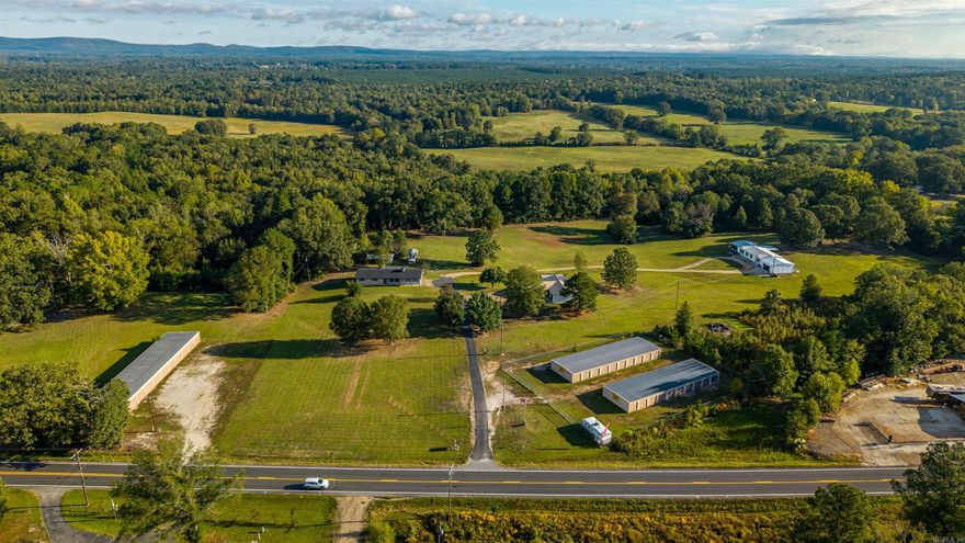 THIS GEM IS A RARE FIND! INCOME PRODUCING INVESTMENT OPPORTUNITY MINUTES FROM LAKE DEGRAY;  Currently has 50 storage units at 95% occupency with plenty of room to add much needed and high demand boat storage.    2 LARGE Homes, massive shop ,2 wells on   Hwy 7 frontage, on 17.94 +\- acres, in addition there's a concrete pad with a seperate address to accommodate a large RV or small mobile home. will cash flow from day one.