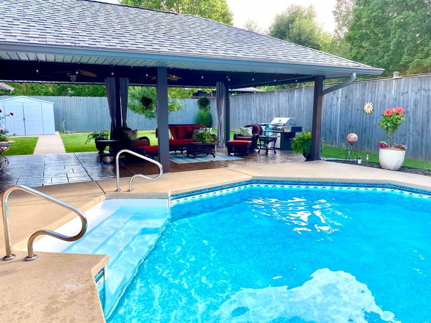 Your Stunning Oasis awaits! Tucked away just minutes from Hot Springs Country Club, this Gorgeous one-story home on a private half acre with a Pool will WOW you! With 4 bedrooms, plus a dedicated office and 2 & 1/2 baths, this home has been updated with new bamboo flooring, new baths and a fabulous kitchen- complete with granite, a stainless gas stove, custom wood vent, and large pantry. The dining area offers lovely back yard views! Truly relax in your spacious primary bedroom suite with a sitting area, 2 Walk in Closets, and an Updated Spa Bathroom to make you feel totally pampered. Three additional bedrooms and a home office give you space to be creative. Great summer memories will always be made with the 36 foot pool and custom covered stone patio...you'll forever feel on Vacation! Plus, there's plenty of grass to run around in, and a Hot Tub! Blueberrys, blackberries and figs are already growing in the side yard, and the 24x12 foot workshop plus garage storage holds everything. New roof in 2024, and the covered RV parking is the cherry on top. Don't miss this truly SPECIAL home in the Lakeside school district- Make your appointment today!
