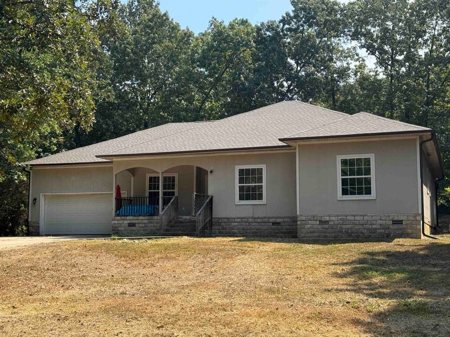 NEW HVAC & NEW ROOF Aug 2025! This charming three-bedroom, two-bath home is ideally located less than a mile from the main entrance of Cherokee Village. Built in 2007, it sits on a private, wooded lot, offering peace and privacy while remaining conveniently close to town. The home features a concrete driveway, a one-car garage with interior access, and two inviting covered porches—perfect for enjoying the natural surroundings. Inside, you’ll find new vinyl flooring throughout most of the home, with tile in the kitchen and main bathroom. High ceilings add to the spacious, open feel of the living areas. The primary bedroom includes a walk-in closet and a large bathroom complete with a jetted tub and a beautifully tiled walk-in shower. The hall bath features a standard tub/shower combo for added convenience. This 18-year-old home has solid bones and great potential. With a little TLC, it could be a wonderful full-time residence or a relaxing retreat in the heart of Cherokee Village. Ownership grants access to the area lakes, golf courses, swimming pools, community center with racketball and exercise equipment. Just a few minutes away from South Fork and Spring River & Old Hardy Town.