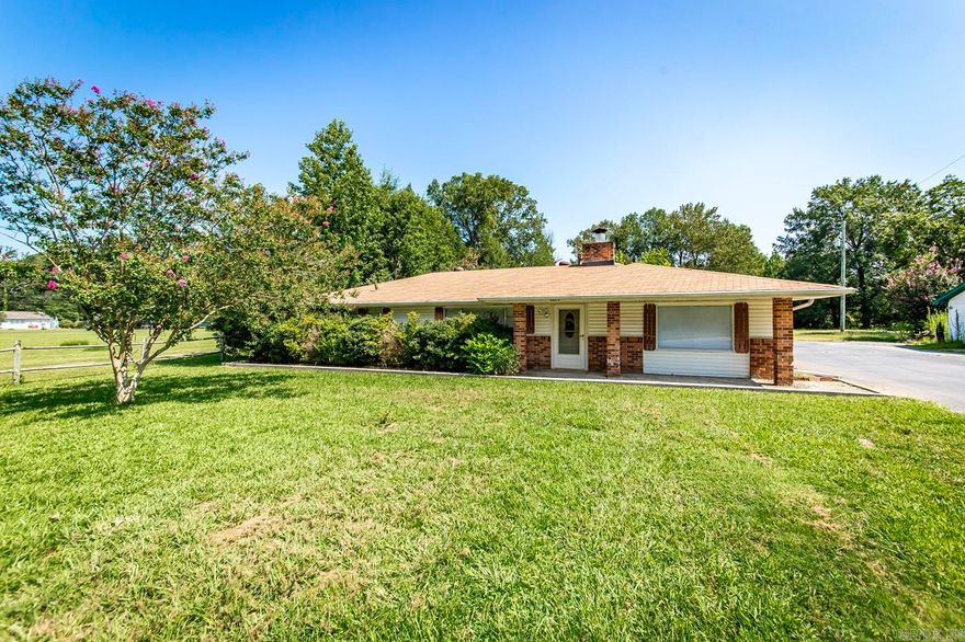 Great home located on 1 acre with 2 shops (20x20 & 15x24) and a pole barn. This home has 3 bedrooms, 2.5 baths, wood burning fireplace, Large open floor plan with the living room, kitchen, pantry, breakfast bar and a huge dining area or you could use it as an office, play area or additional living room space. Large bar area for coffee or refreshments.  Seller has added the third bedroom with a full bath and you can install the flooring of your choice.  Master bedroom is good size and has room for a second closet to be installed if you need two closets. Large carport on the side of the home.  Driveway is asphalt and shared with the house next door.  Don't miss out on this great property with lots of shop space for all of your storage and work space needs. *** Seller is offering a $15,000.00 allowance for buyer to use for home improvements or upgrades ***