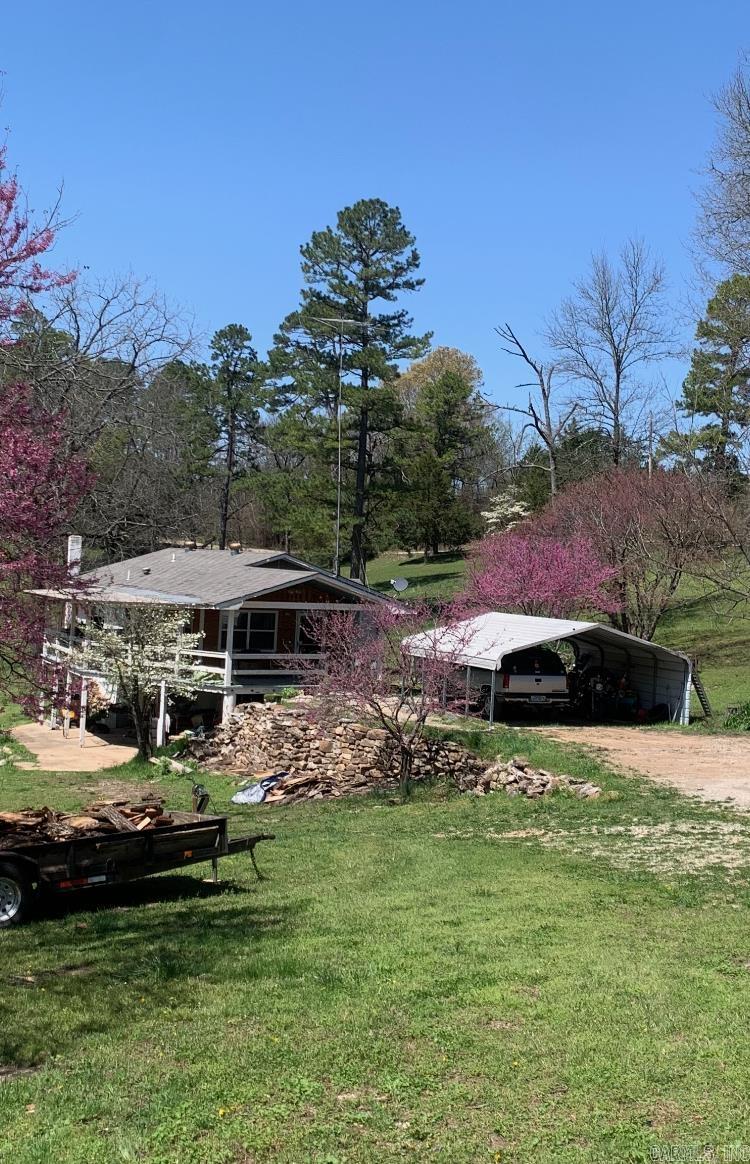 Charming 3BR/2BA traditional home set in a peaceful country setting just off a paved road. Spacious floor plan offers a large den, full basement, and game room for family fun. Enjoy outdoor living on the oversized covered deck overlooking cross-fenced pasture-perfect for horses or livestock. A barn adds extra storage or hobby space. Conveniently located near the Buffalo National River, White River, and Bull Shoals Lake. This property offers endless opportunities for fishing, boating, and outdoor adventure. Don't miss this rare combination of comfort, recreation and country charm!