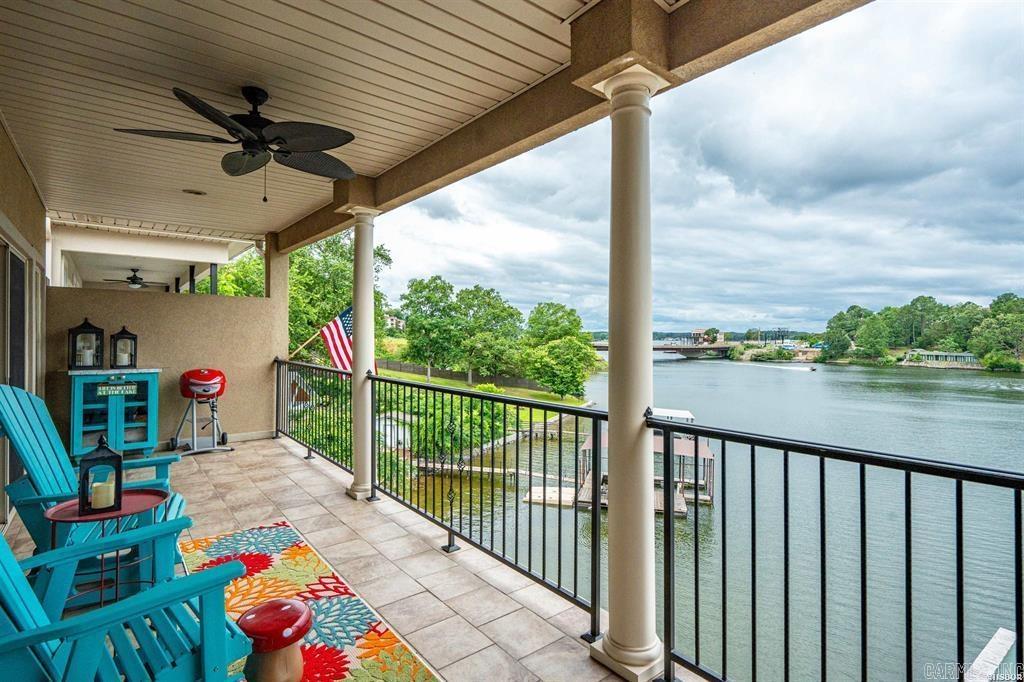 Welcome to the Lake!! This bright and open condo is waiting for your weekend fun. Condo is on the top floor with an exterior elevator right at your front door, so take advantage of the lake views without the worry of stairs. Assigned parking spot is also right by the elevator. You will enjoy the open floor plan and views of the lake. The primary suite is spacious with a large walk-in closet and the bath offers both a walk-in shower and a large tub. Located in a prime location both by road and on the lake, this condo is perfect for dinner, shopping and boating. The complex allows nightly rentals as well, so could be a great income producing property. New HVAC in 2017, microwave in 2024, extensive renovation of the patio in 2022.