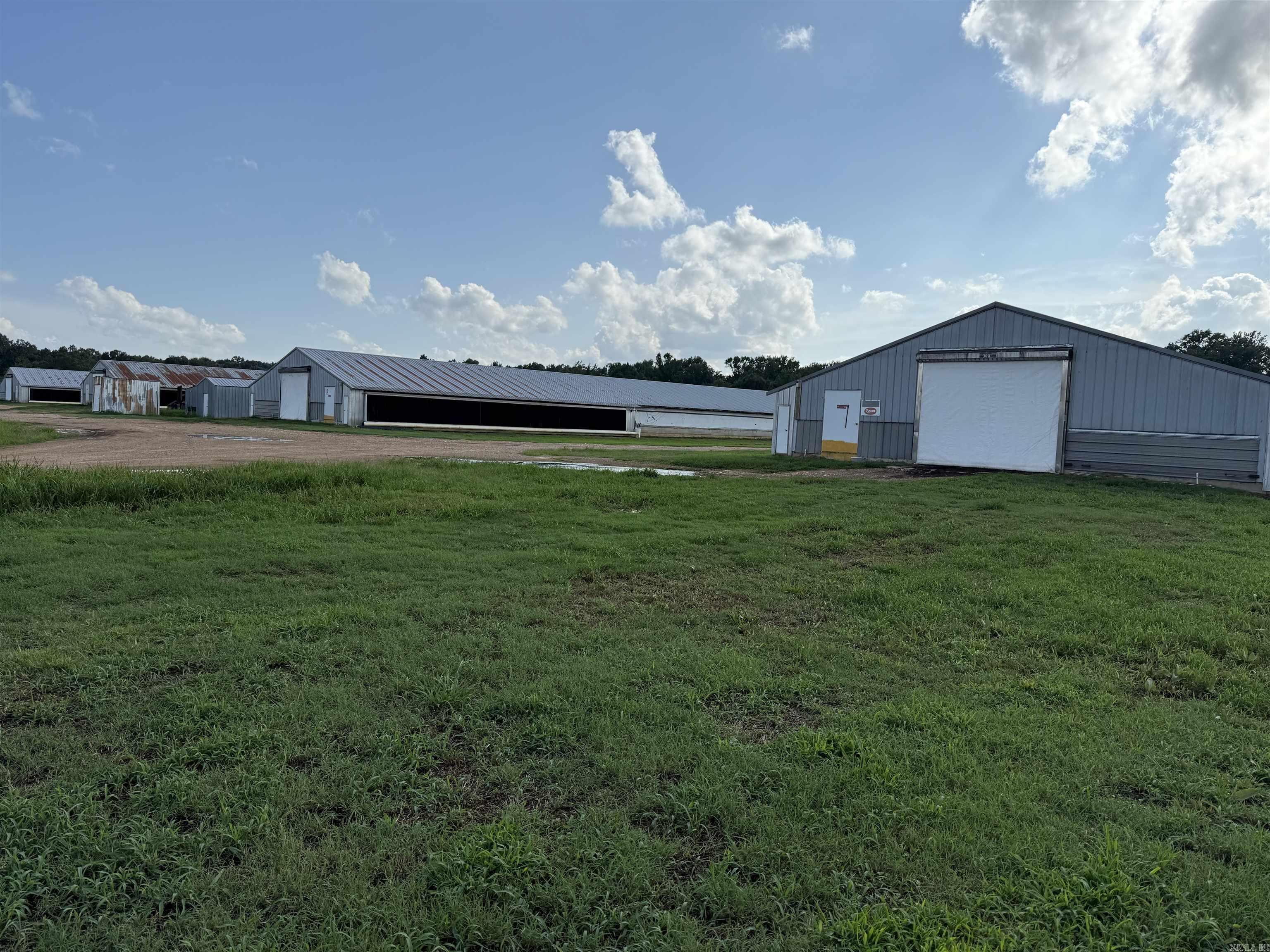 Poultry operation in Hempstead County offers 10 house broiler farm on approx. 46 acres. Property offers a brick home with approx 1,650 sq ft of living space. Current Tyson Contract, two generators, three wells, emergency rural water available, extra cool cells, poultry houses were totally updated in 2019. Some equipment and supplies will convey to new owner, including a tractor and two farm trucks. Contact our office for more details.