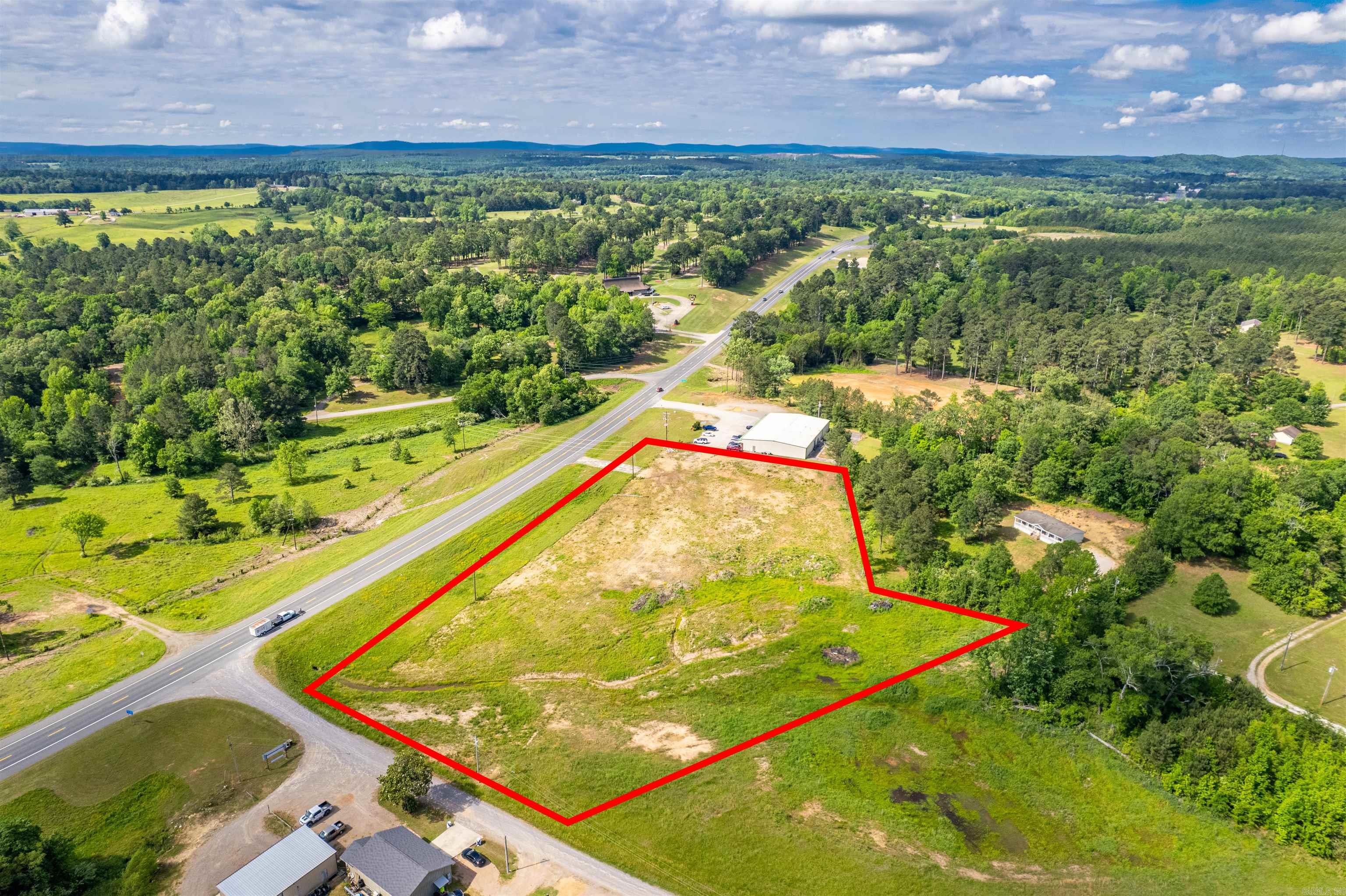 Prime Commercial Lot, fully cleared and engineered for multi-family and commercial development. City approved sewer extension with completed engineering plans are in place, streamlining the path to development. Ideal opportunity for investors or developers! Located just minutes from Caddo River access.