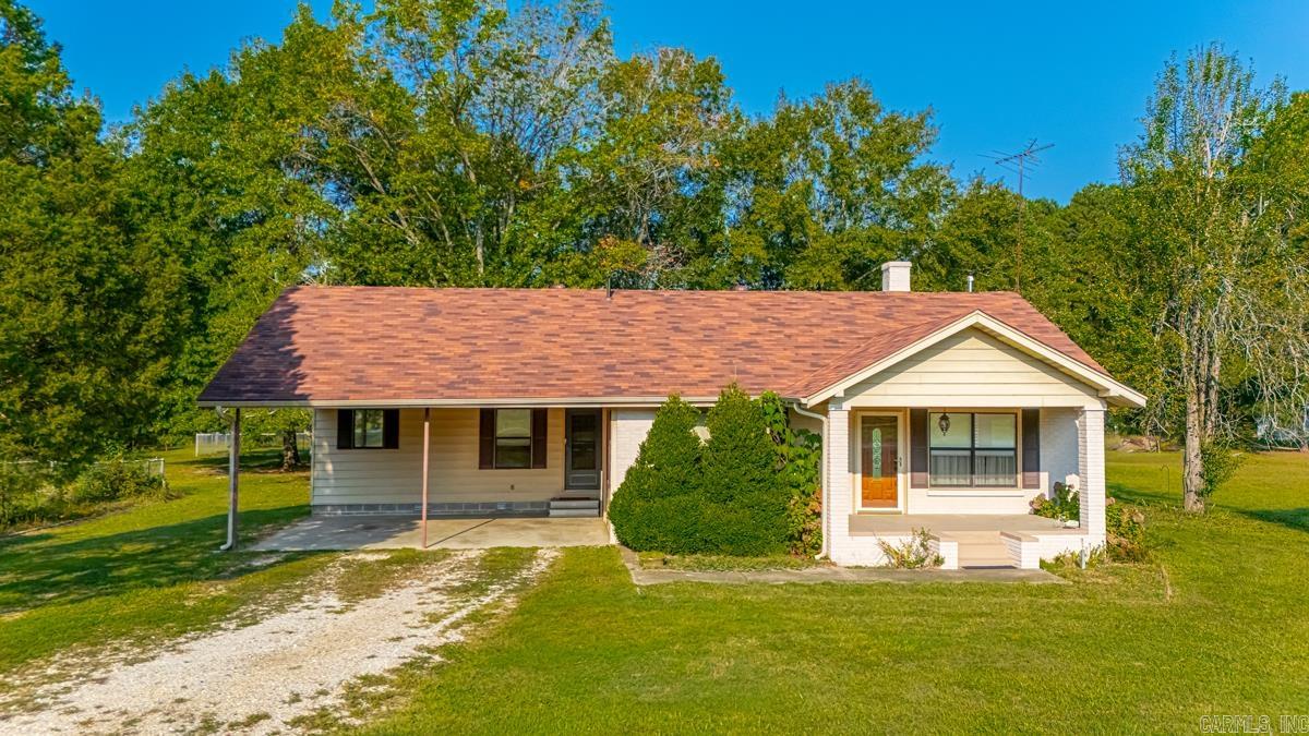 This beautiful 3-bedroom, 2-bathroom home offers two spacious living areas, a cozy fireplace, and a dedicated office, providing both comfort and functionality. Around the home, you’ll find plenty of convenient workspaces, including two built-in desks and built-in shelves for storage and organization. Situated on 5 acres, the property features 3 fenced acres of pasture with a pond, a 28x40 shop, a fenced dog kennel area, and a large back porch perfect for entertaining or relaxing outdoors. There’s also a designated area for a garden, making it easy to grow your own vegetables or flowers. Recent updates include a new roof and gutters in September 2023 and a Rheem hot water heater installed in August 2022. With thoughtful updates, spacious living areas, and room to enjoy both inside and out, this property is ideal for those seeking a peaceful country retreat with modern convenience.