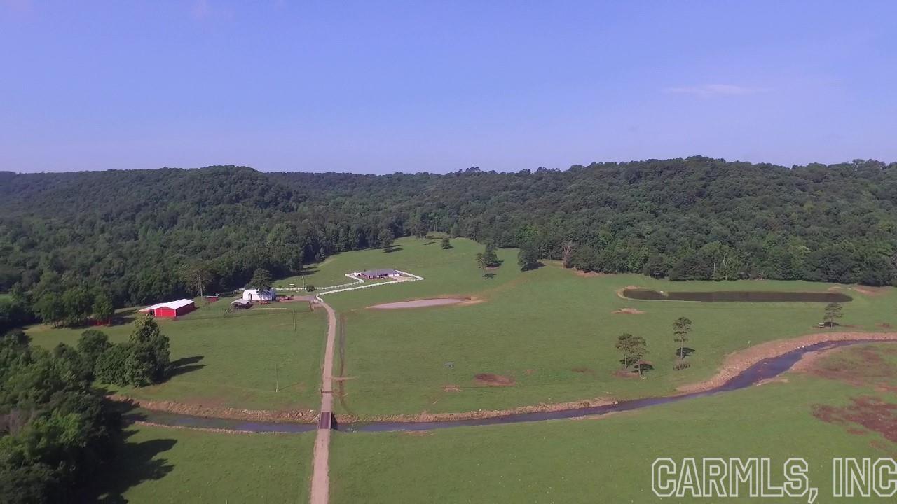 ONE OWNER, HORSE AND CATTLE PARADISE with BEAUTIFUL views in the OZARK MOUNTAIN foothills. This PRISTINE 197+/- acre cattle farm is manicured and turnkey ready for the new owners. SIX PONDS and THREE CREEKS provide year round water in addition to a MUNICIPAL WATER supply and a DEEP WELL for gardening/livestock. This CUSTOM BUILT 2600+/- sft home has NEW ROOF w/transferable LIFETIME WARRANTY SEPT. 2021, NEW HVAC MAY 2021, NEW WATER HEATER 2020 and FIBER OPTIC INTERNET. Call to schedule a showing today!