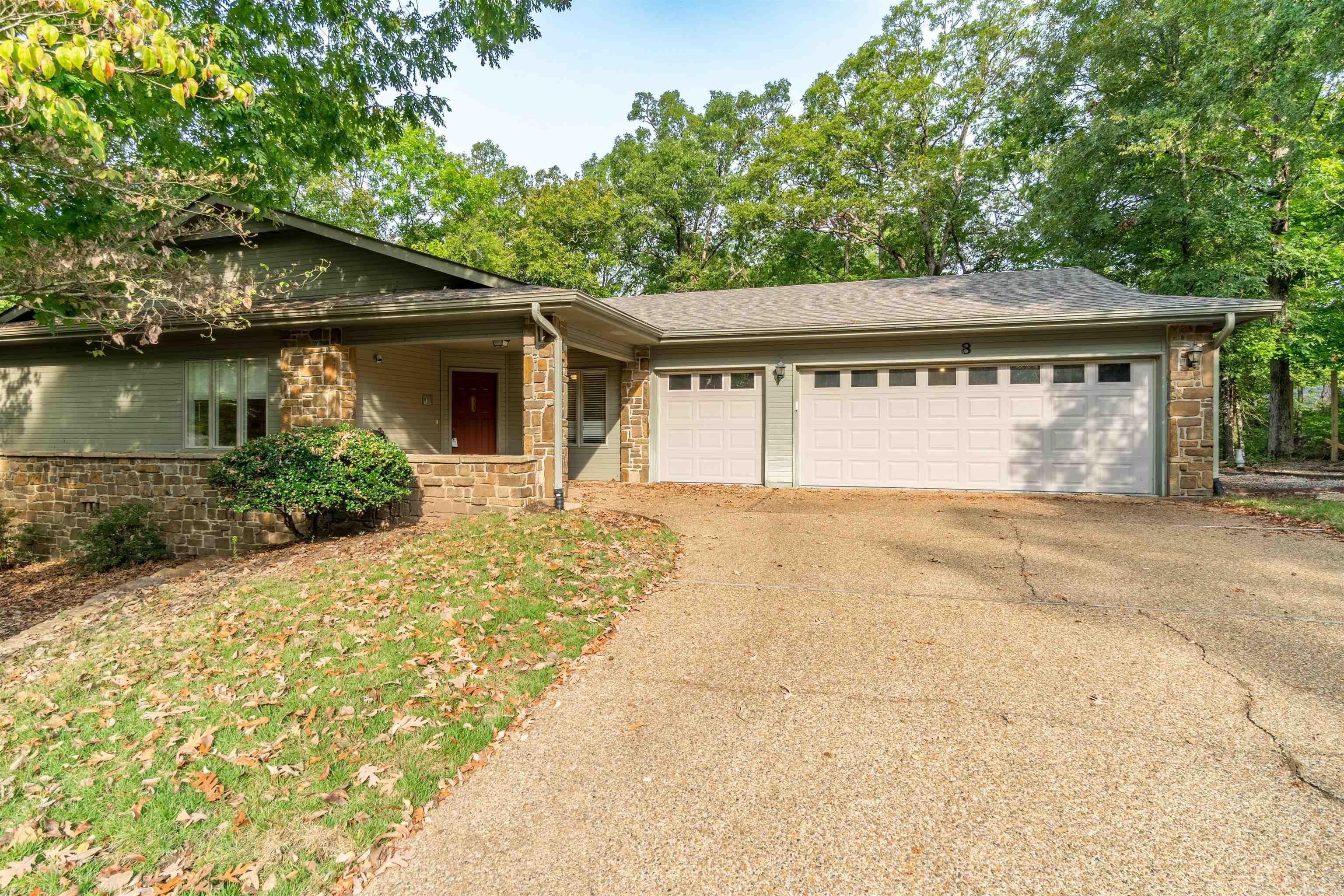 This is a well-liked revision of Cooper Homes Dover Plan - divided bedrooms, large open great room has coffered ceiling and engineered birch flooring, corner wood burning fireplace and sliders going out to open private deck & wooded view. No "popcorn" ceilings. Generous kitchen with island, pantry, breakfast nook, going out to screened porch. Convenient utility room with desk area just off kitchen. There's a 2 car garage adjoining a golf cart garage and a huge storage area at end of 2 car garage. The lot is very gently sloping just enough for good drainage and street ends in a cul-de-sac. Very convenient to Balboa Lake, beach, dining, 5 golf courses and the Woodlands Auditorium. SEE AGENT REMARKS