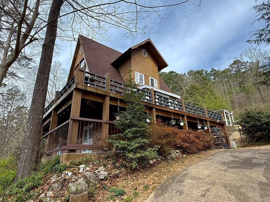 Wake up to peaceful mountain views and enjoy your morning coffee from the deck, surrounded by mature trees and nature. This 3,267sqft+/- home offers a unique and inviting layout, featuring a stunning master suite on the lower level and an upper level loft that overlooks the living room and captures breathtaking views through expansive two-story windows. The spacious finished basement provides plenty of room for entertaining, relaxing, or family fun, while the secluded acreage filled with fruit trees, blackberry & blue berry bushes, fig trees, chicken run, and much more invites outdoor exploration and privacy. For those seeking even more space, an additional 25 acres is available for purchase.