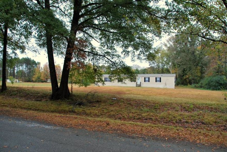 Four bedroom, two bathroom, 16x80 manufactured home with a large yard in Letona.  This home was built in 2009 and will save you thousands rather than buying new.  It is setup on 2 acres and is move in ready.   A brand new home this size would cost this amount and that doesn't include the cost of the land and improvements.  Financing options are available on this home.  Call me today to see this home!