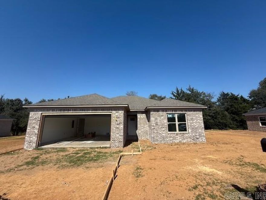 You will absolutely love this floor plan. No wasted space, living room in the back with views out the windows to a tree line between you and the neighbor. The kitchen is open to the dining area and living room.  Granite countertops in the kitchen along with a beautiful island. There is a dedicated pantry as well! Tray ceiling in the living room.  The primary suite is bright and airy with windows that let in tons of natural light. Large walk-in closet in primary bedroom. Split floor plan with other bedrooms apart from primary. 3 bed/2 bath brick home with 2 car garage tucked away in the Parkway Estates Subdivision in Morrilton. This is a great location.  You can be at schools, shopping, and restaurants within 5 minutes.  UACCM is growing, and it's just right down the road. Enjoy peaceful hikes at Petit Jean State Park less than 30 minutes away. Contact your lender to see if you qualify for a $0 down payment loan on this home! Agents, see remarks.