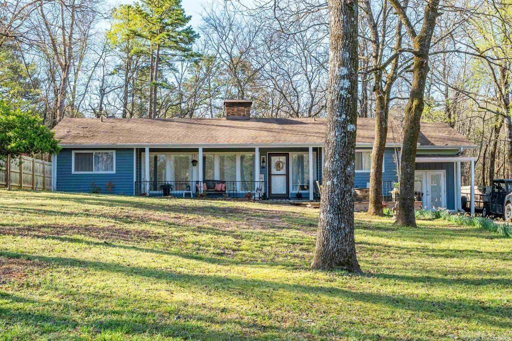 This adorable home is ready for a new owner! There are so many features, it is hard to mention them all. Enjoy the front porch sitting area, just across the street from the golf course. 3 bedrooms, 2 full bathrooms, private office, and spacious laundry room. The sunroom features a hot tub and office to overlook the back yard, surrounded by nature for extra privacy. The primary suite has a heated jetted tub, double vanity, and walk-in shower. Don't forget the mancave just off the front porch. All mounted TVs convey. On top of everything in this home, you have the amenities of Diamondhead just minutes from downtown Hot Springs & Oaklawn racetrack. Diamondhead offers a PGA sanctioned golf course, Olympic size swimming pool, children's playground, tennis, basketball & pickleball courts, clubhouse, community library, exercise room & lots of friendly neighbors.