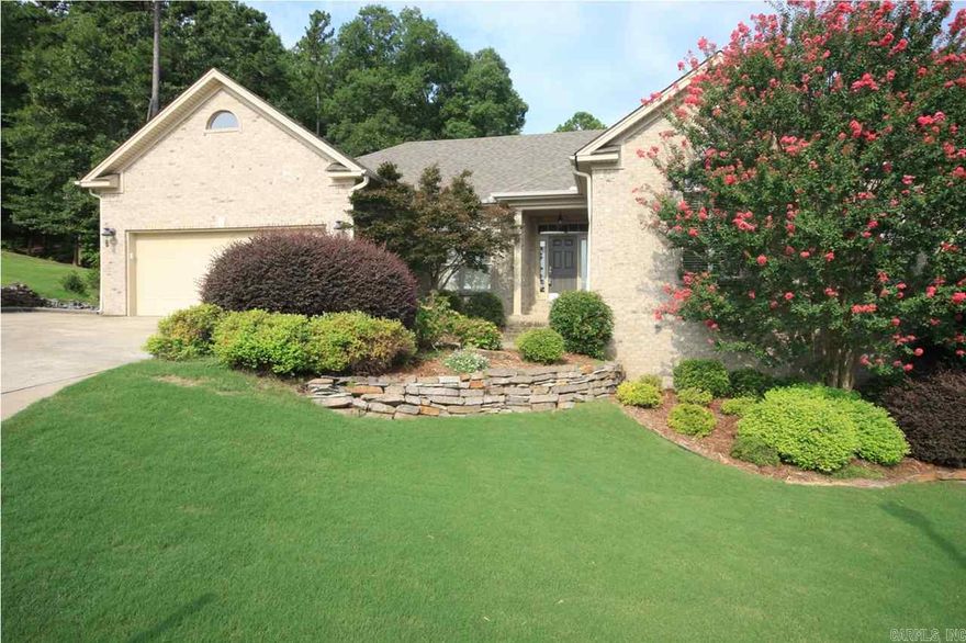 Chenal Valley home in a cul-de-sac w/ wooded green space behind. Main level has 3 BR/2 full BA, big open kitchen w/ granite counters, stainless steel appliances, ice-maker in island, large walk-in pantry, & double-sided fireplace to living room w/ vaulted ceiling; NEW hardwood floors in October 2016; Downstairs area features a bonus room w/ wet bar, 1 BR/1 full bath, and an incredible 700 sq ft storage room w/ cedar closet. Sprinkler system & central vacuum system are bonus features. One year Home Warranty.