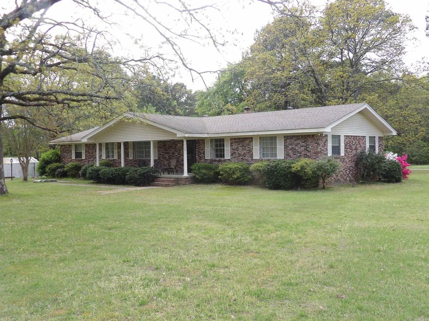 Great location is just the beginning of the many features this 3 bedroom, 2 bath home features.  Two (2) large living areas with gas fireplace. Large utility room, walk-in shower, updated kitchen appliance, large storage room located off the carport, metal storage unit, washer/dryer, refrigerator to remain. Beautiful lawn, patio area. Located just minutes from Sandy Beach and Greers Ferry Lake.