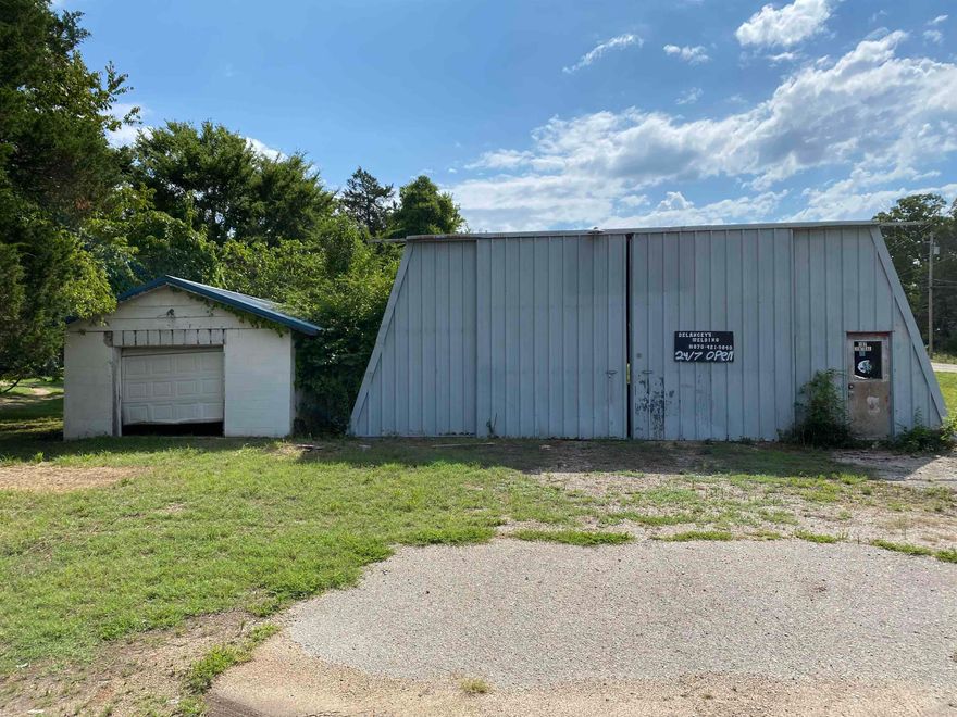 IN THE HEART OF FLIPPIN, AR, an exciting opportunity awaits for entrepreneurs and investors looking to make their mark. Presenting a prime commercial property with highway frontage, this space is a canvas for your business aspirations. This property comes equipped with a 30x40 metal building, a 15x20 block building, and a small storage building at the rear. These versatile structures provide a wide range of possibilities and could easily serve as the foundation for various business ventures. Whether you're looking to establish a retail store, a workshop, an office space, or even a restaurant, the existing buildings offer the flexibility to suit your needs. This property offers a location with excellent visibility & accessibility on a prominent highway frontage. Flippin's central location, along with its vibrant community, makes this property a valuable asset for any business endeavor. Seize the chance to turn your vision into reality today.