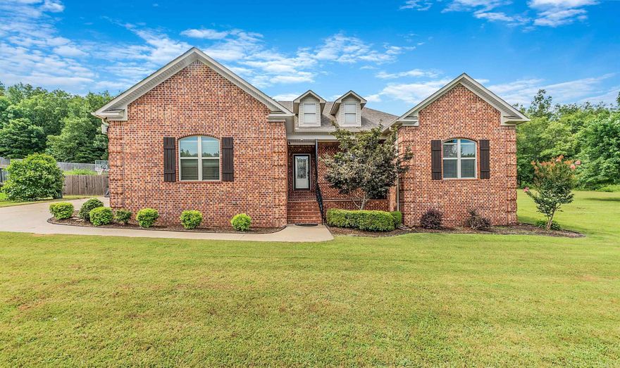 Welcome to your dream home. This stunning 4 bedroom, 2 bath home offers something for everyone. Featuring an open/split floor-plan with tall ceilings and a kitchen perfect for cooking and entertaining at the same time. The master bedroom has tray ceilings and a master bathroom with double vanity, double closets, a jetted soaker tub and walk-in shower. Step outside to your private oasis. The backyard is paradise with an in-ground pool and hot tub. Rewind under the pergola and listen to the peaceful sounds of the the pool waterfall. The pool house has a full bathroom, mini fridge, sink, and additional garage storage on the side. This beautiful home sits on 1.69 acres and includes a storm shelter in garage floor. New roof and fiberglass liner in 2023.