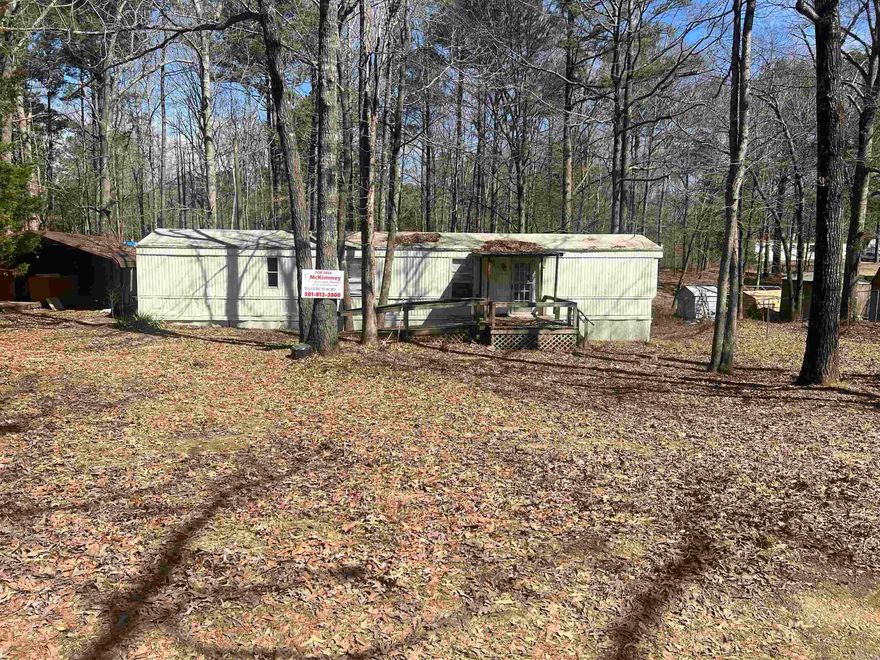 Come see 1 acre lot  right outside city limits .Very quite neighborhood  with mailing address established and all utilities available l. Currently fenced with a signal wide manufacture home ready that can replaced or redone.