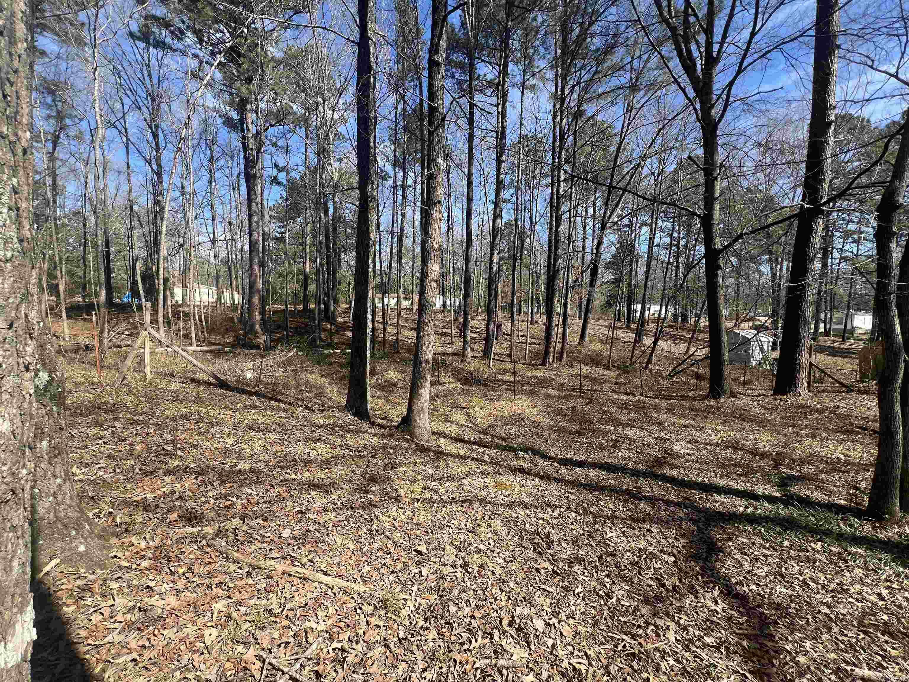 Come see 1 acre lot  right outside city limits .Very quite neighborhood  with mailing address established and all utilities available l. Currently fenced with a signal wide manufacture home ready that can replaced or redone.