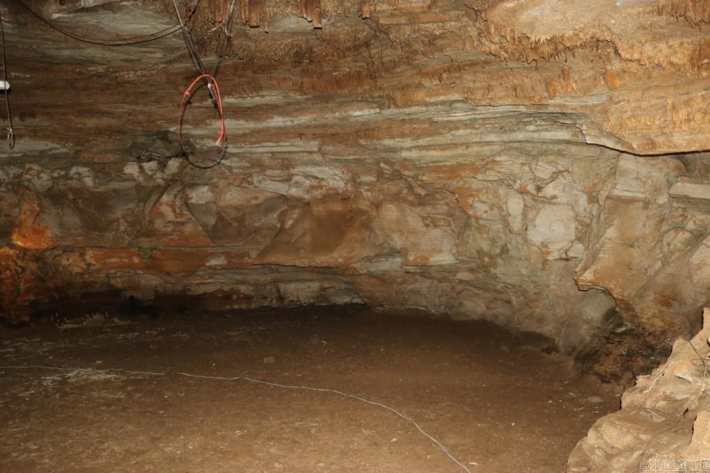 For Sale: 90 Acres with Large Cave - A Unique Property in Stone County, AR Location: 20 minutes from Mountain View, AR Discover a once-in-a-lifetime opportunity to own 90 pristine acres in Stone County, Arkansas, featuring one of the largest caves in the area. This extraordinary property is a paradise for outdoor enthusiasts, offering endless possibilities for personal enjoyment or commercial development. 90 Acres of Untouched Beauty: Explore vast expanses of mature timber teeming with wildlife, including deer, turkey, bear, birds, and squirrels. Perfect for nature lovers, hunters, and anyone seeking serenity in the great outdoors. Large, Accessible Cave: This remarkable cave boasts built-in pathways, ample standing room, and easy access throughout. Whether you're looking to create a unique Airbnb experience, host cave tours, or simply enjoy a private retreat, the potential is limitless. Private yet Convenient: Enjoy complete privacy on this expansive property while being just a short 20-minute drive from the charming town of Mountain View, AR. Mountain View is renowned for its rich culture and outdoor activities, with the Ozark Folk Center, White River, Ozark National Forest.