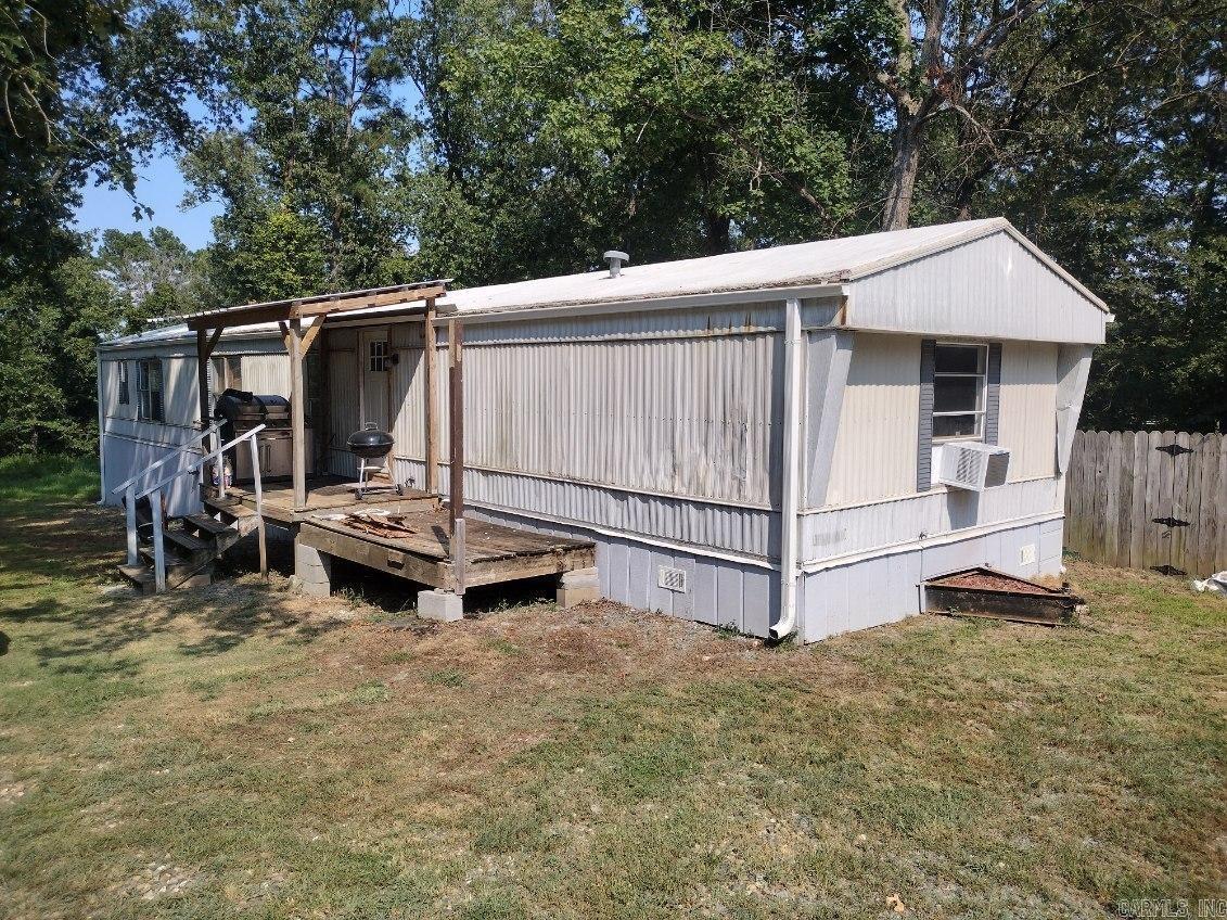 Incredible opportunity at affordable living or an addition to your investment portfolio. This 3 bedroom, 2 bath home has new gutters, new plumbing and new flooring. A large master bedroom and bath with a walk in tile shower and a storm shelter add to the amenities that this property has to offer. Sitting on +/- 1.43 acres and only a few minutes to town and I-30 access.