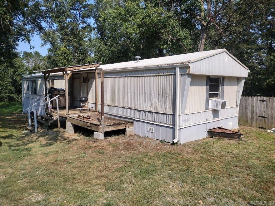 Incredible opportunity at affordable living or an addition to your investment portfolio.  This 3 bedroom, 2 bath home has new gutters, new plumbing and new flooring.  A large master bedroom and bath with a walk in tile shower and a storm shelter add to the amenities that this property has to offer.  Sitting on +/- 1.43 acres and only a few minutes to town and I-30 access.