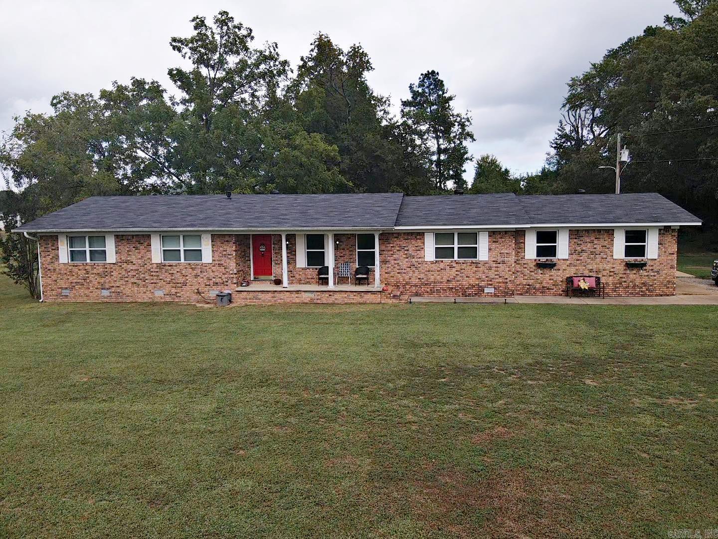 This beautiful brick home sits on 1.08 manicured acres in a great rural area. The living room and dining room flow together in an open concept while the kitchen, laundry room and two-car garage are around the corner. There are 3 bedrooms, 2 bathrooms and a bonus room, designed as a dining room, it is now being used a 4th bedroom with two sliding doors. The covered patio on the back of the house is a great place to start and end each day. A storage shed is also on the back of the property. Priced to sell, this one will not last long, call today! Agents, please see remarks.
