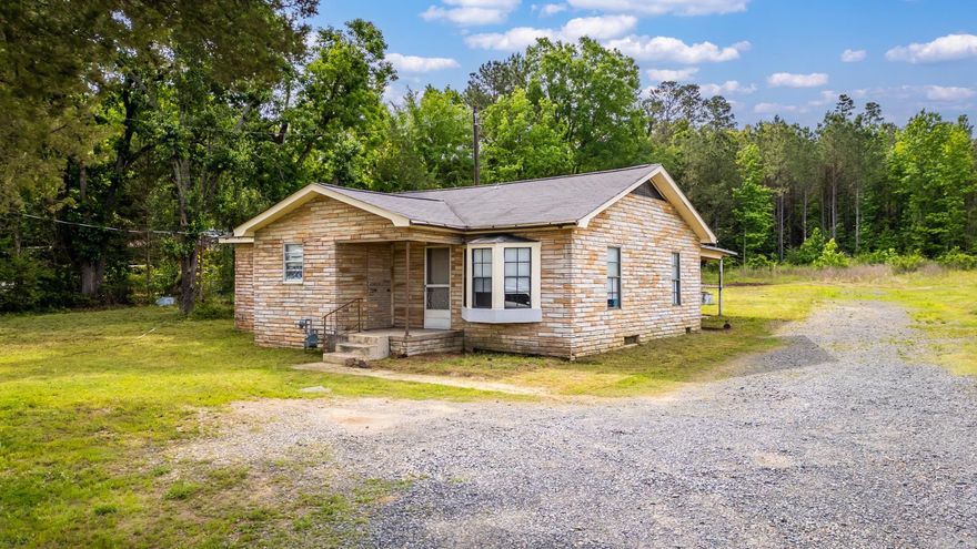 Great rock home with acreage!