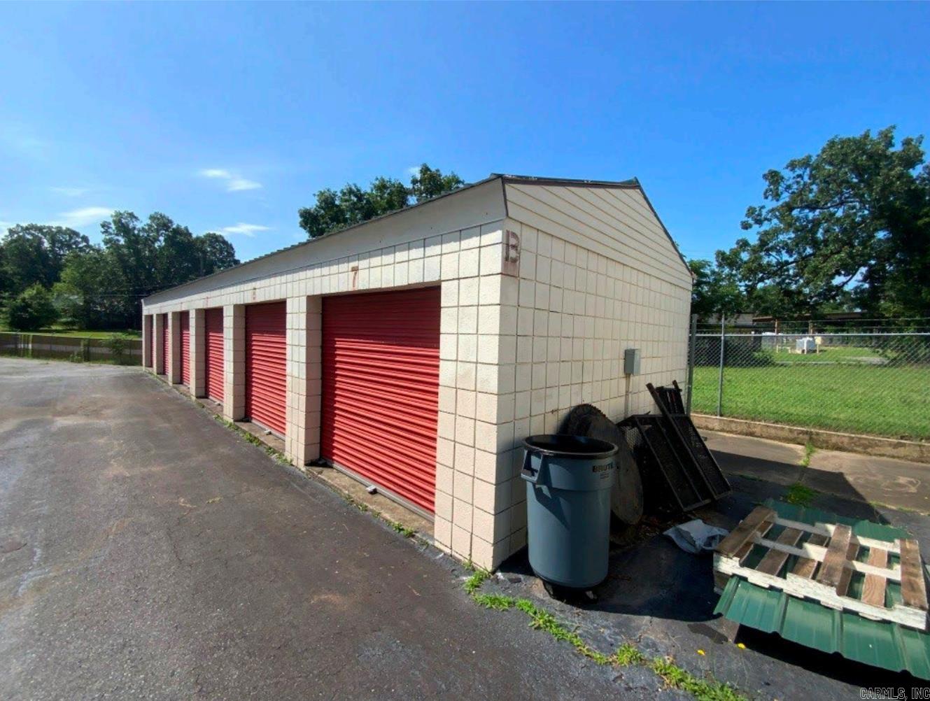 For Sale: Income-Producing Mini-Storage Facility – Sherwood, AR Located on a ±0.56-acre portion of a ±0.83-acre parcel, this well-maintained self-storage facility offers 49 rentable units across 7 buildings totaling ±6,135 SF of rentable space (±6,533 SF gross). Constructed in 1993, the property is in average condition with roof replacements scheduled for 2025. Unit mix includes (37) 10'x15' units at $65/mo and (12) 5'x10' units at $45/mo. Each unit features 9–11' ceilings. Facility is currently 91.84% occupied. Additional income from outdoor trailer parking at $15/mo. Property has access via a ±0.02-acre easement to AR-107 and frontage along Hillcrest Rd. High visibility, easy access, and stable cash flow make this an excellent investment or owner-operator opportunity. Strong local demand with upside potential through rent increases or minor upgrades. Contact Arkansas Land Company to schedule a showing.