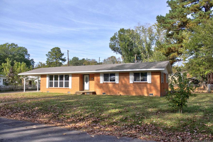 Welcome to this updated 3 bedroom, 1½ bath home with nearly 1,600 square feet of living space. The open kitchen - dining area has been updated into a stunning kitchen space outfitted with sleek granite countertops, an under mount sink, stainless steel appliances including an electric range and dishwasher, plus mission-style painted cabinetry with soft close doors & drawers, making cooking and storage both enjoyable and practical. The main bathroom has also been refreshed, offering a spacious dual sink granite topped vanity and updated lighting for a fresh, polished look. Original hardwood flooring flows through two of the bedrooms, with new carpet in the third bedroom, all set against a tasteful, neutral paint scheme that complements any style. Updates continue with replacement vinyl windows & patio door. A spacious laundry room adds convenience, complete with an adjacent bonus half bathroom. Situated on a generous 1/3 acre lot, the backyard is ideal for outdoor entertaining, featuring a welcoming patio space ready for barbecues, gatherings or simply enjoying the open air. This move-in ready home combines comfort, style, and convenience.