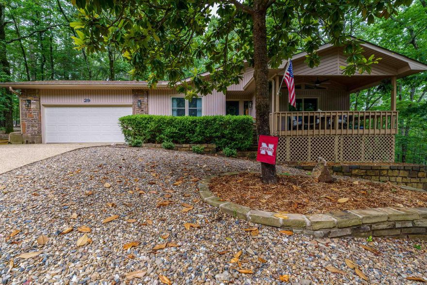 MUST SEE! Conveniently located just minutes from the amenities outside of the West gate, this beautifully updated home has no shortage of privacy. It has 3 decks, 2 living rooms and two car garage with new epoxy floor. Some of the updates include brand new Pella windows and sliding glass doors, new interior doors, trim, flooring and custom drapes, updated kitchen with quartz counter tops, stainless steel appliances, stone backsplash, new sink, faucet and disposal, and so many more updates! Third bedroom and bathroom downstairs as a possible mother-in-law suite. Gorgeous built-ins throughout home. Newer roof, HVAC's and 2021 encapsulated crawl space. Come see this beautiful home today! See Agent Remarks