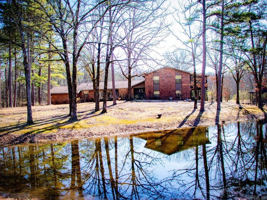 Great Location on Denny Road with 5 +/-  level acres and a large pond!  This home is a classic - Great bones, almost all brick - just a little facelift needed.  Three bedrooms, large living room with brick fireplace, separate dining room and private office.  There is also a separate bonus/hobby room off the back porch that is heated and cooled.  There are two Two-car garages that can be accessed from the home, one is 585 sq ft and being used as a shop.   Great garden area and beautiful views!  City Water!