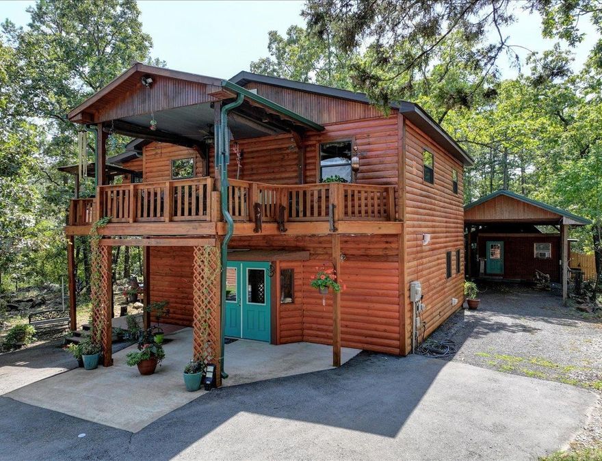 This spacious 2-story home, complete with a guest cabin and art studio, is perfect for multi-generational living or creating a peaceful retreat for your family. Guest cabin and art studio add an additional 1,160 sq ft. Main house features 2 beds, 2 baths, custom kitchen, screened sunroom, and partially covered deck. Lower level offers a large bedroom, full bath, sauna, and laundry, making it an excellent option for private living space or an in-law suite. The charming guest cabin includes 1 bed, 1 bath, a kitchen, and a private deck, offering a separate space for extended family or visitors. The art studio/workshop is ideal for creative pursuits, featuring a bar area and kitchenette. Additional amenities include a gym, massage room, a large heated/cooled garage with Wi-Fi, and two RV hookups (30 amp & 50 amp). Recent updates include new septic field lines, termite protection, and refinished siding and decking. Located near lakes, parks, and major cities, this property offers a serene retreat for multiple generations with endless possibilities. The garage and guest cabin are on separate electric meters for added convenience.  Agents - Call Showing service to schedule all showings.