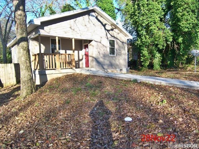 Near the heart of downtown Hot Springs, you'll find this 2020 built, traditional style home ready for its new owners. Easy to clean wood floors, separate laundry room, covered patio and spacious fenced in backyard. Conveniently located near countless stores and restaurants. Don't wait to schedule your showing today. Text listing agent for showing. See agent remarks.