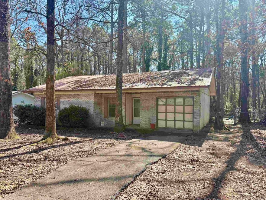 This single-family home is perfect for investors or first-time homebuyers. Situated in a quiet neighborhood, the home offers the perfect blend of comfort and convenience. Located just minutes from Lake Hamilton, you'll have access to a neighborhood boat launch and picnic area—ideal for fishing and enjoying the water. With great potential as a primary residence, flip project, or long-term investment property, this is an opportunity you don't want to miss! Call Meadow or Adrian to schedule your showing today.