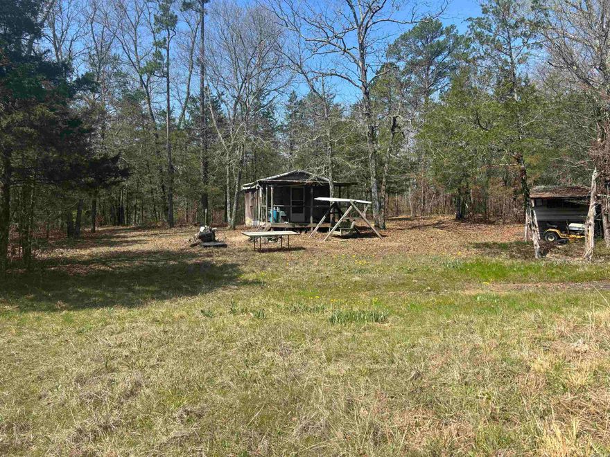 Escape to your own secluded wilderness with this remote 40-acre hunting property, featuring a mix of mature pine and hardwood timber that provides excellent habitat for wildlife. This land is a true outdoorsman’s retreat, teeming with deer, bear, turkey, and hogs—making it ideal for hunting or recreational use.  A small rustic cabin sits on the property, offering a simple basecamp for your outdoor adventures. With no utilities and a private, off-grid setting, this property is perfect for those seeking solitude and a back-to-nature experience.  Access is via a private road with no legal easement, enhancing the property’s privacy and seclusion. Whether you’re looking for a hunting getaway, a quiet retreat, or a long-term land investment, this tract offers abundant natural beauty and potential.