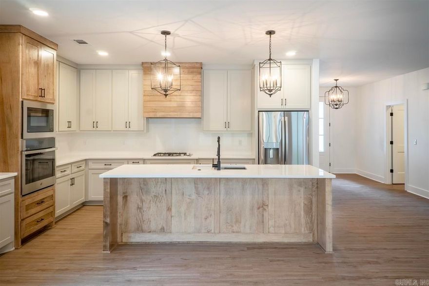 This popular Peppercorn plan is a 3/2.5 with an oversized 2 car garage. Lots of windows to bring the outdoors in. This chef's kitchen includes custom wood cabinetry that extends all the way to the 9ft ceiling and has a fabulous walk in pantry. Laundry room connects to the primary bedroom.  Luxury vinyl flooring throughout and custom tile work in your bathrooms.  Your back porch comes equipped with a gas fireplace for year round enjoyment. Interior photos are of an existing home of the same floorplan. Still time to choose your colors, flooring and counters. Call for floor plan