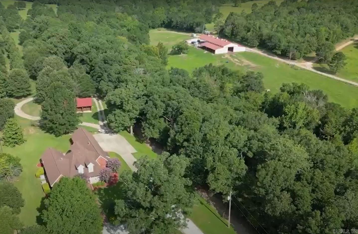 200 acre with the most beautiful drive along the Caddo River to and from the Beautiful ranch with two homes a large log house in the woods and a 4 bedroom craftsman house, with horse stalls in back yard with a office or can addated to be mother in laws house very easily/ The main house sits on top of ridge, This has a very large barn open floorplan barn, behind a beautiful gate and drivway over looking the Caddo River area across the road from the house. the next driveway has beautiful gated entrance with a view of large barn with a open floor plan you can use for livestock, equipment, with stalls and can allow indoor riding. The is located on Mill creek which runs into the Caddo River just across the road from the large log home. There is three lots developed that would be great to build more living areas for family, rentals or Sales on the road to the log home. The Caddo river is full of tourest that float the area. This property offers so many different uses and income streams. The seller is open and wiling to sell one home alone, both homes, one of the three lots, all lots or just land. Owner Fiancing available with acceptable down payment